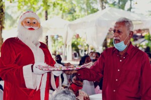 Santa Claus greeting senior citizen